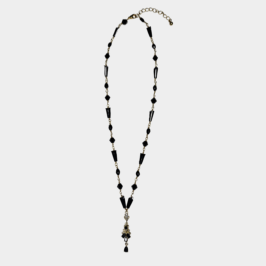 Necklace with black and gold wire on a white background
